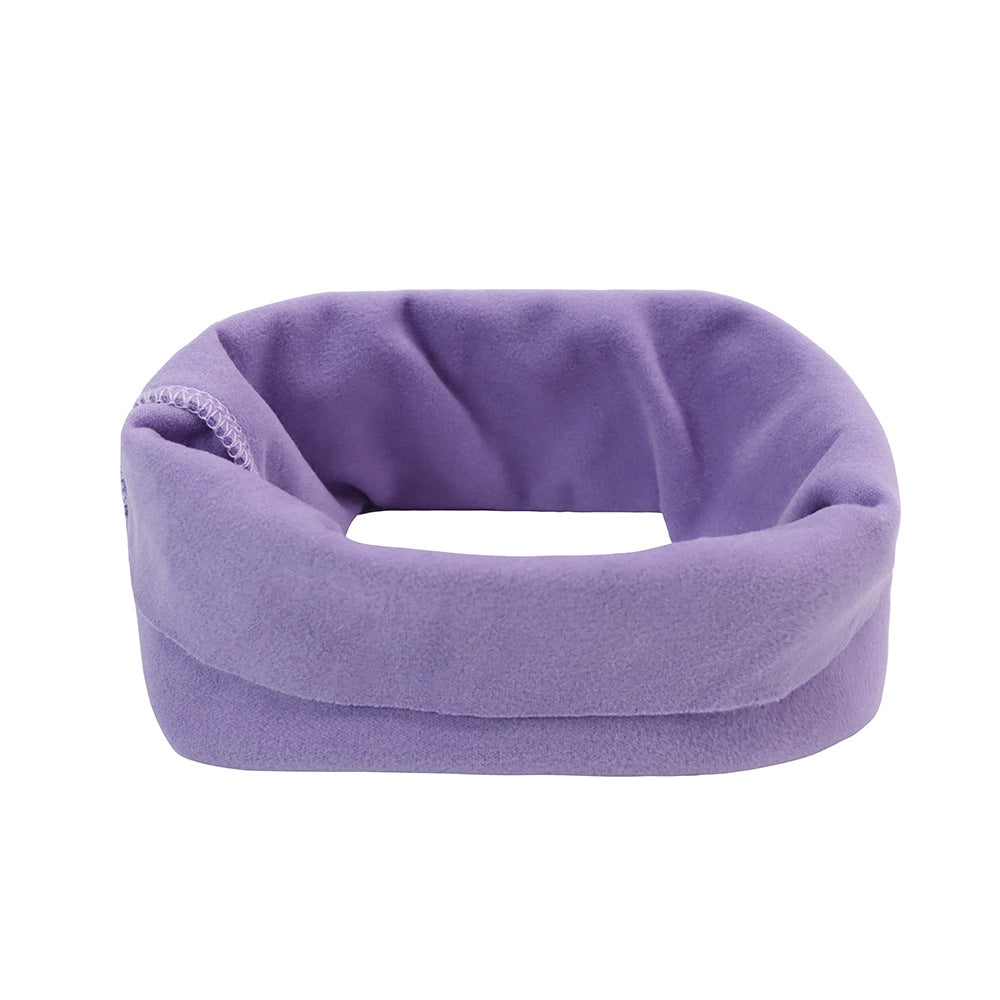 Purple neck pillow on a white background